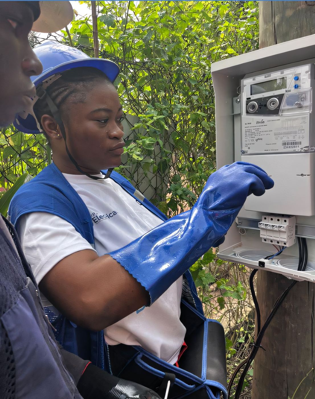 Close-up of an electricity meter being inspected by an ELSIM technician